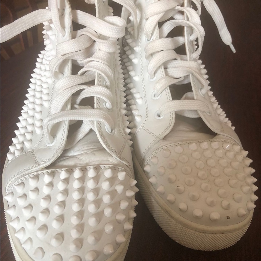 White Christian Louboutin  size 41 1/2    (9 1/2 )   10.    2 studs are missing